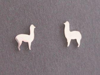 Cute silver alpaca earrings with a stylish design, handmade from 95% pure silver, displayed in a black velvet jewelry pouch.