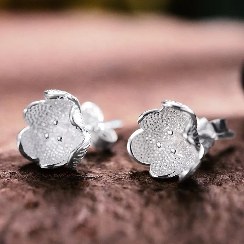 Dainty Blooms stud earrings featuring floral design in sterling silver with warm 18K gold plating, perfect for everyday elegance.