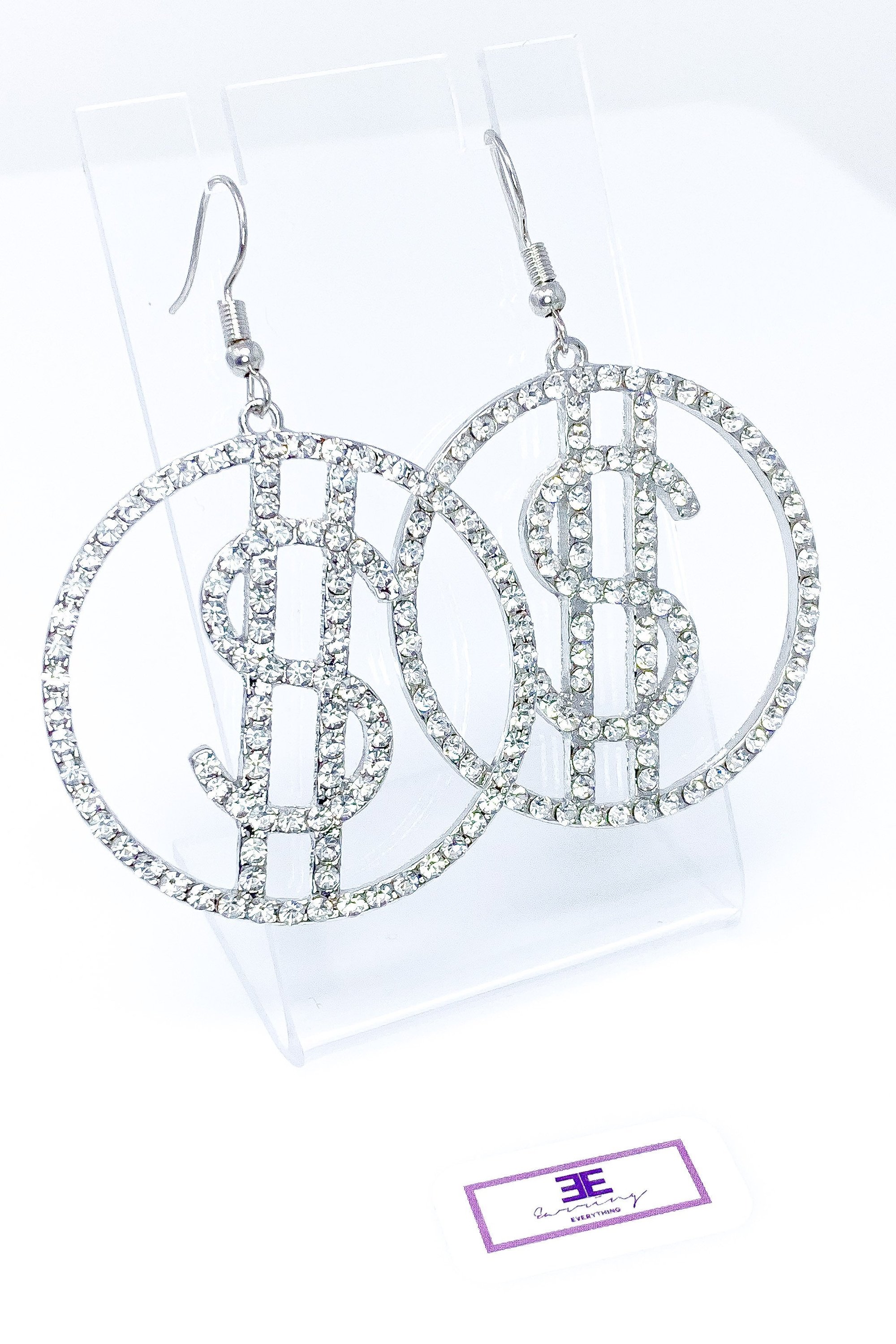 Dangle - Cash Period drop earrings featuring a money symbol design in silver, made from high-quality zinc alloy.