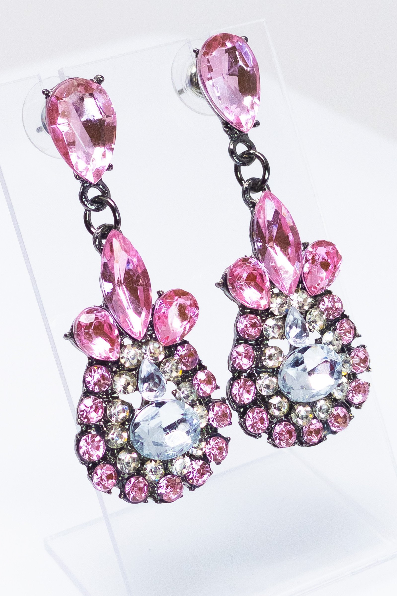 Dangle - Charisma Earrings featuring sparkling rhinestones in a teardrop design, available in pink and blue colors.