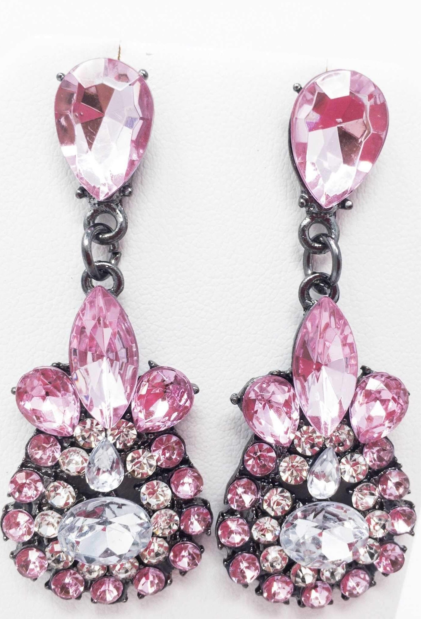 Dangle - Charisma Earrings featuring sparkling rhinestones in a teardrop design, available in pink and blue colors.