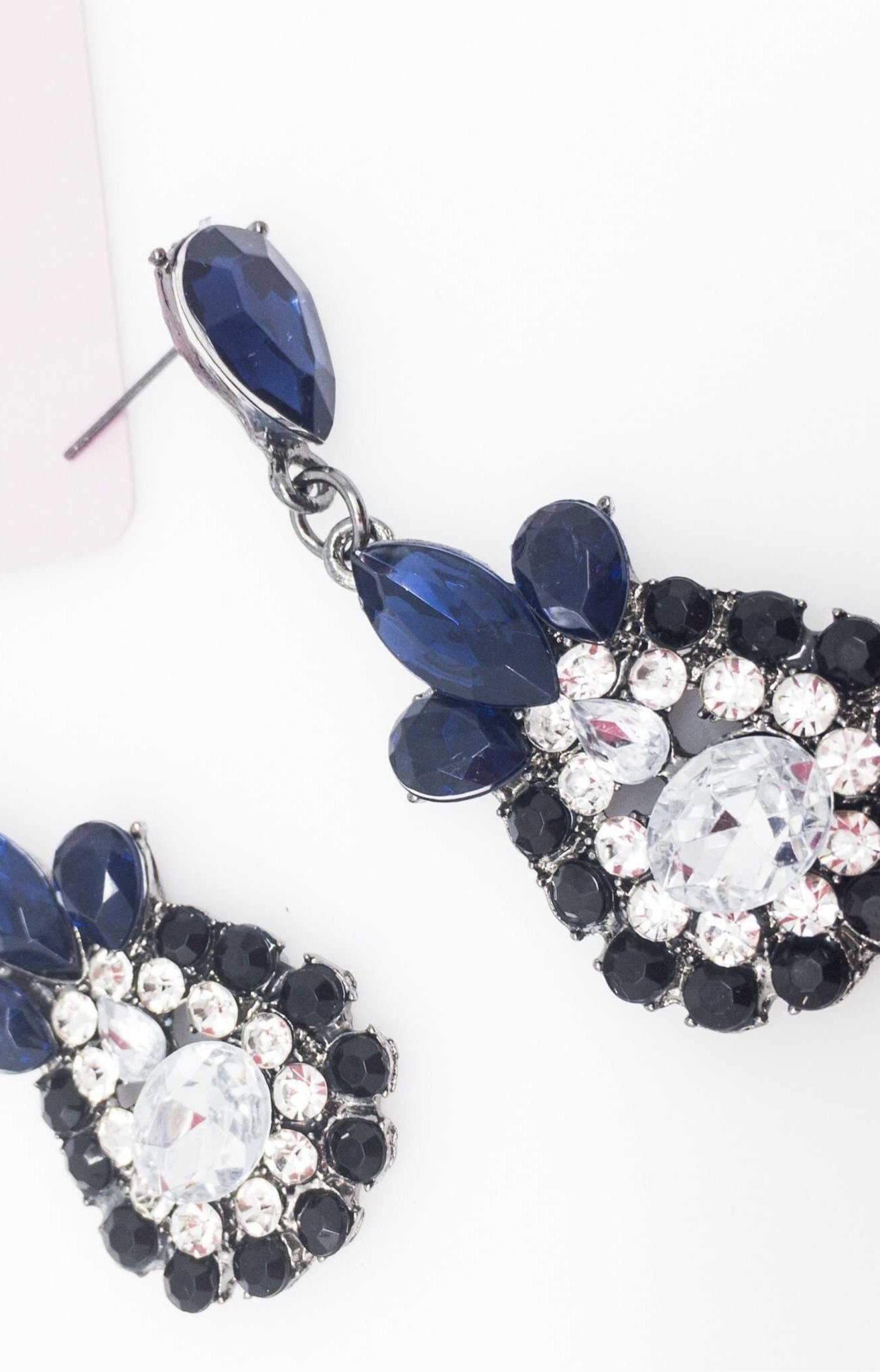 Dangle - Charisma Earrings featuring sparkling rhinestones in a teardrop design, available in pink and blue colors.