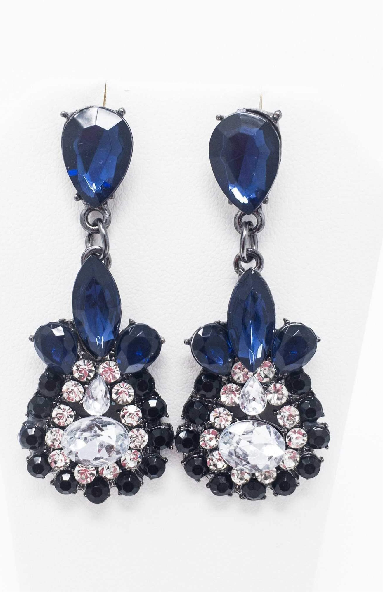 Dangle - Charisma Earrings featuring sparkling rhinestones in a teardrop design, available in pink and blue colors.