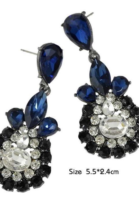 Dangle - Charisma Earrings featuring sparkling rhinestones in a teardrop design, available in pink and blue colors.