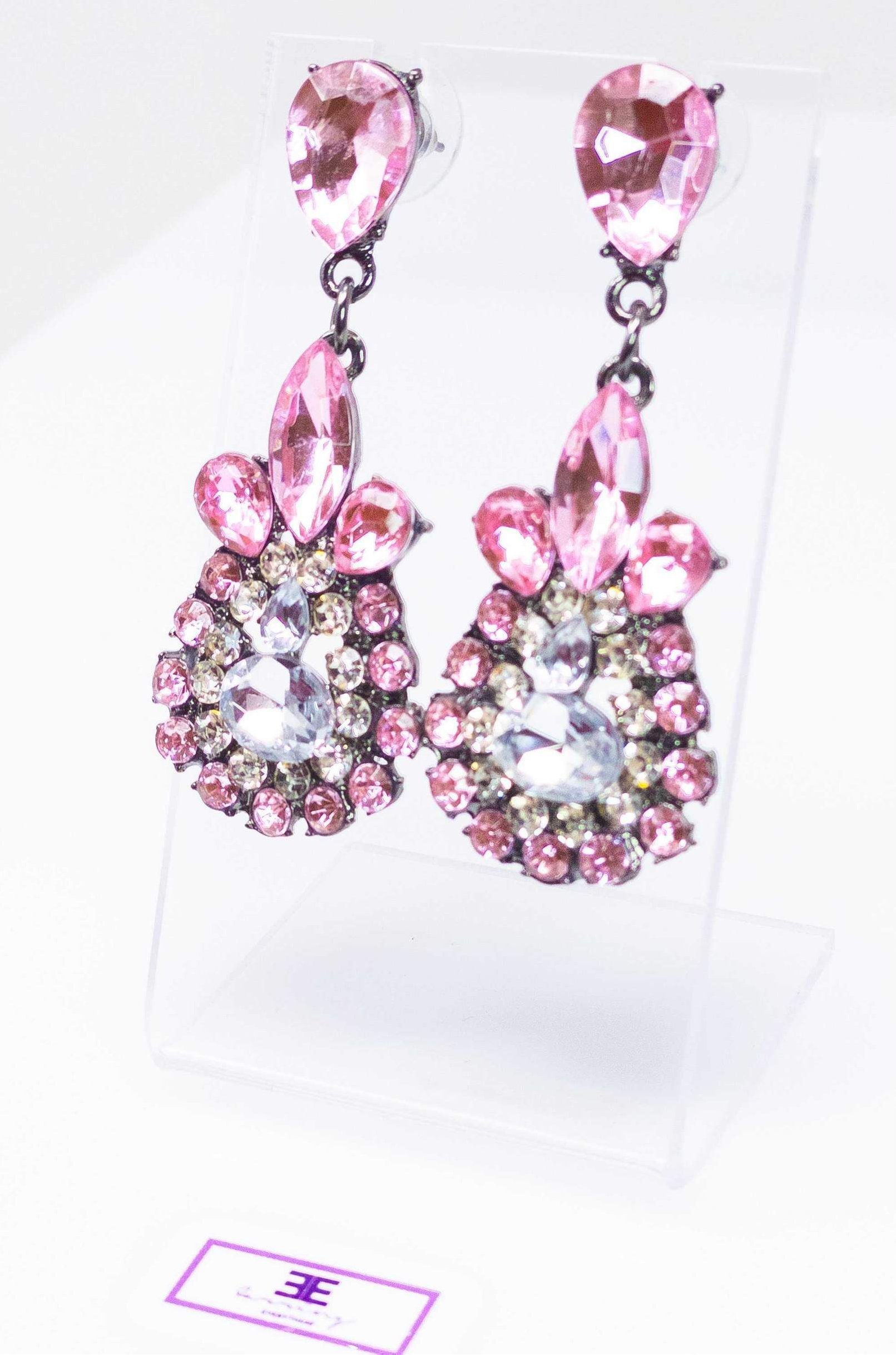 Dangle - Charisma Earrings featuring sparkling rhinestones in a teardrop design, available in pink and blue colors.