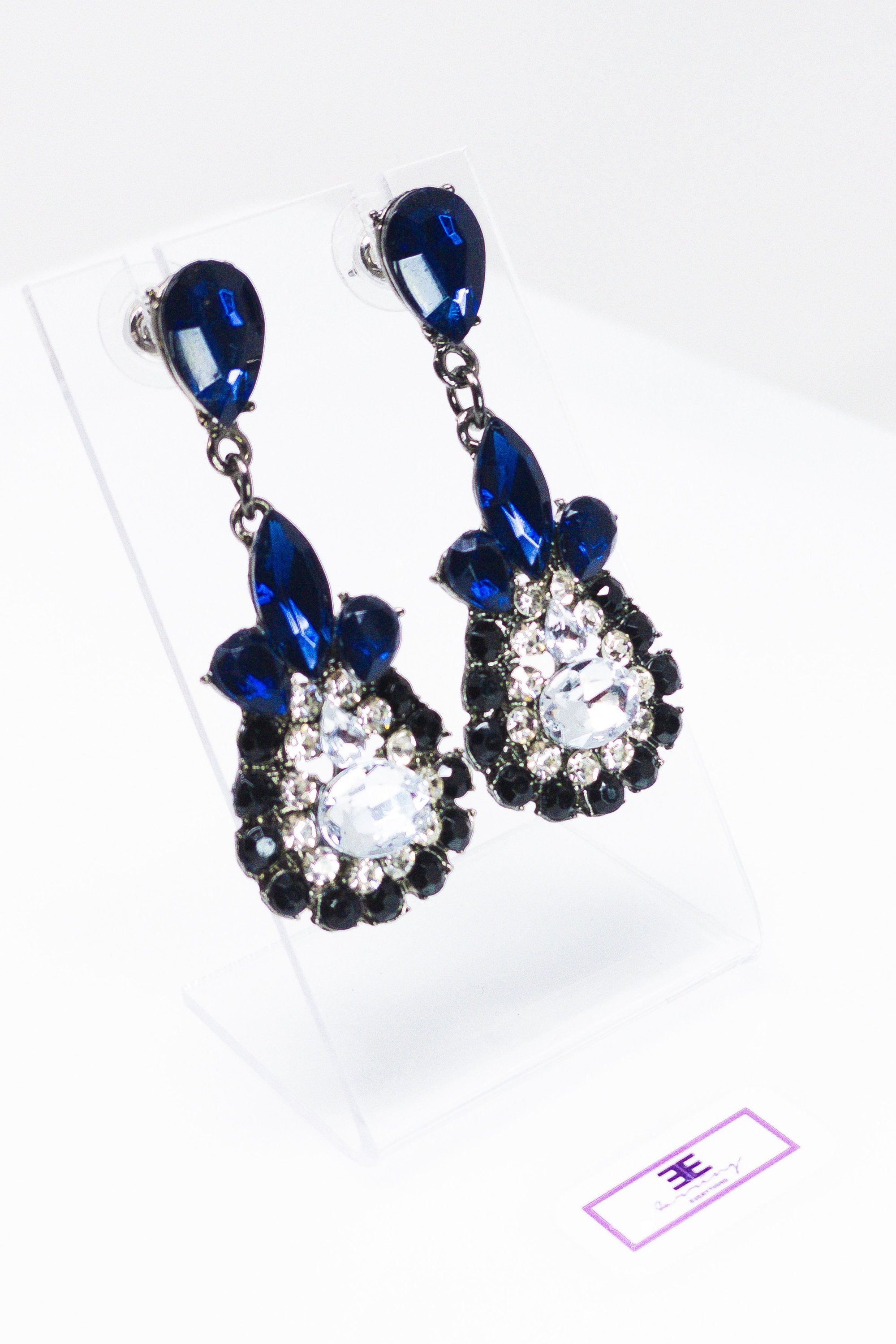 Dangle - Charisma Earrings featuring sparkling rhinestones in a teardrop design, available in pink and blue colors.