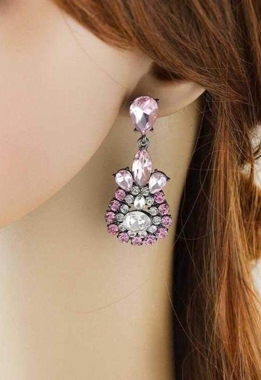 Dangle - Charisma Earrings featuring sparkling rhinestones in a teardrop design, available in pink and blue colors.