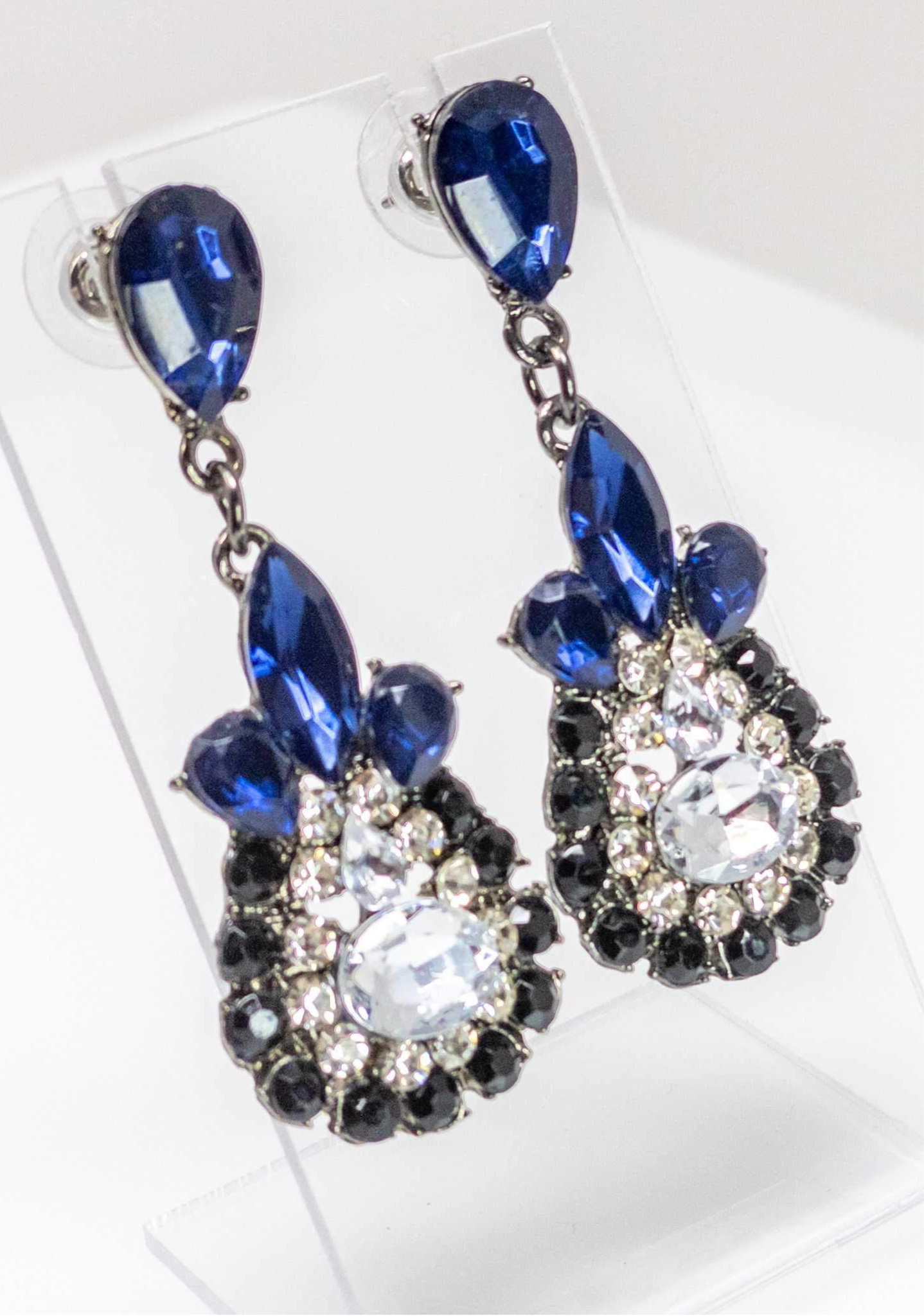 Dangle - Charisma Earrings featuring sparkling rhinestones in a teardrop design, available in pink and blue colors.