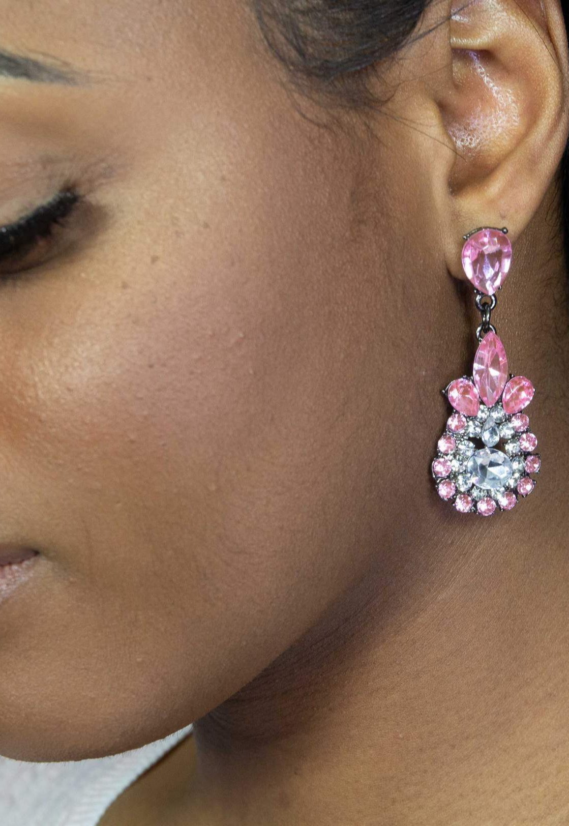 Dangle - Charisma Earrings featuring sparkling rhinestones in a teardrop design, available in pink and blue colors.