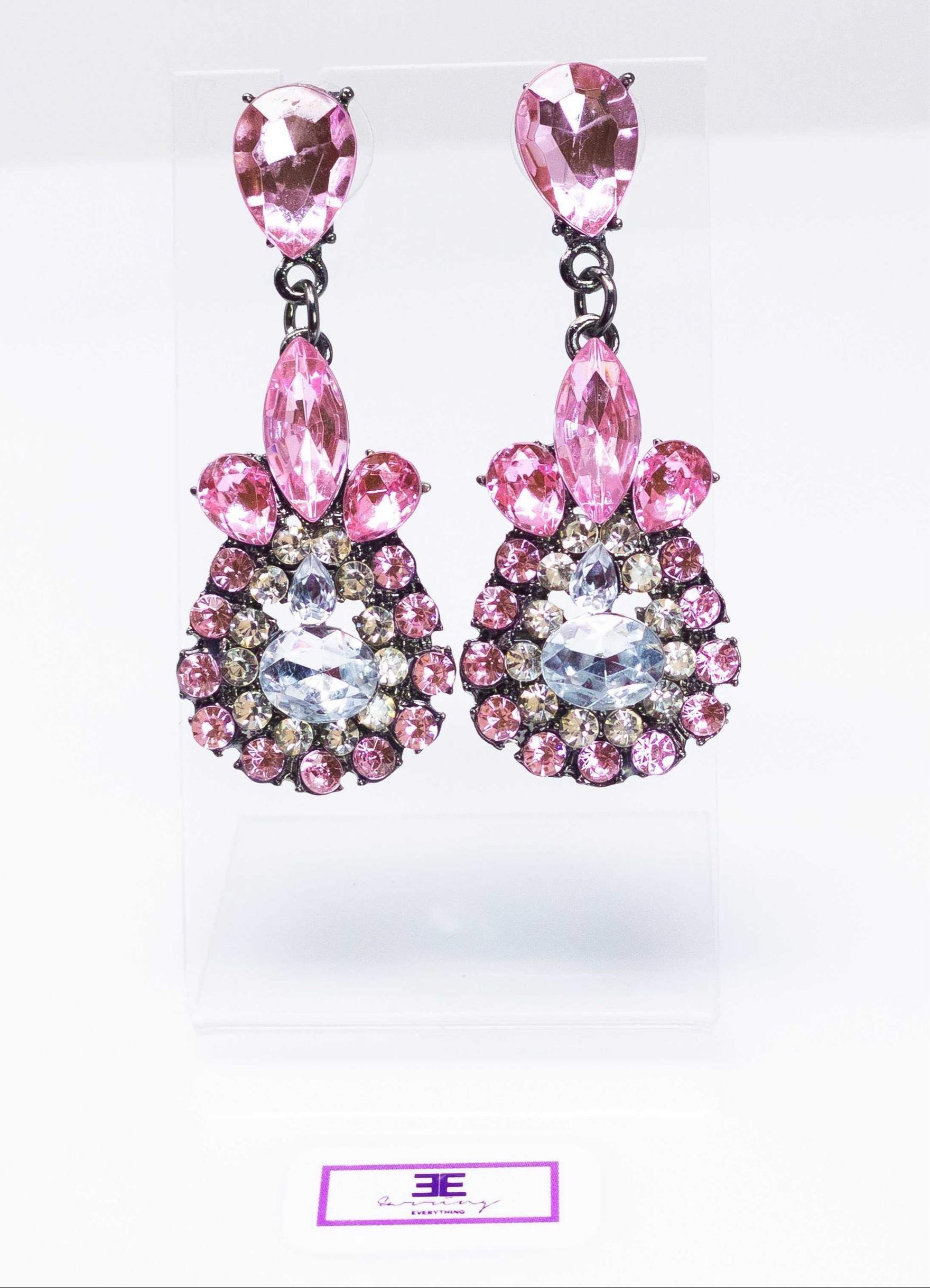 Dangle - Charisma Earrings featuring sparkling rhinestones in a teardrop design, available in pink and blue colors.