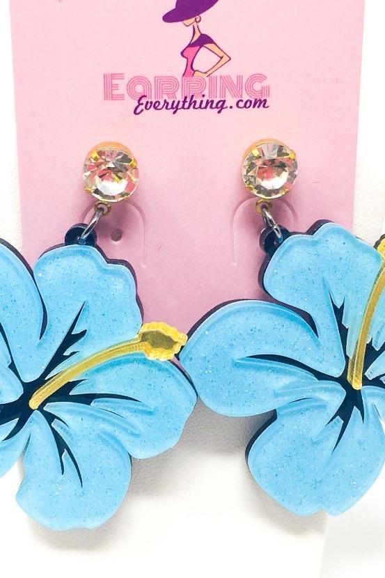 Dangle Hawaiian Hibiscus earrings featuring pink and blue acrylic sparkle drop design in a geometric heart shape.