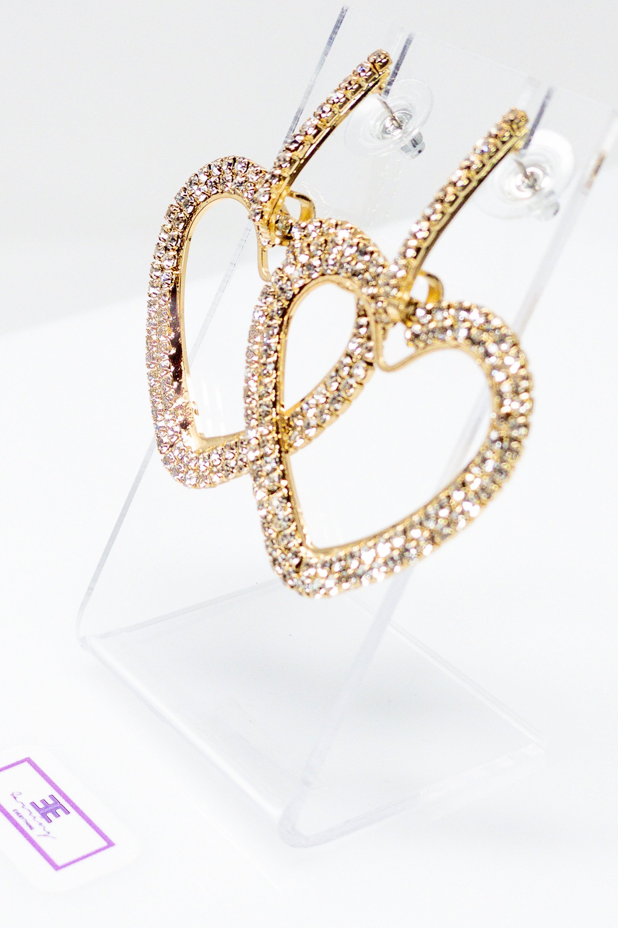 Dangle - Kitty Love earrings showcasing sparkling geometric designs in gold, rose gold, silver, and black colors.