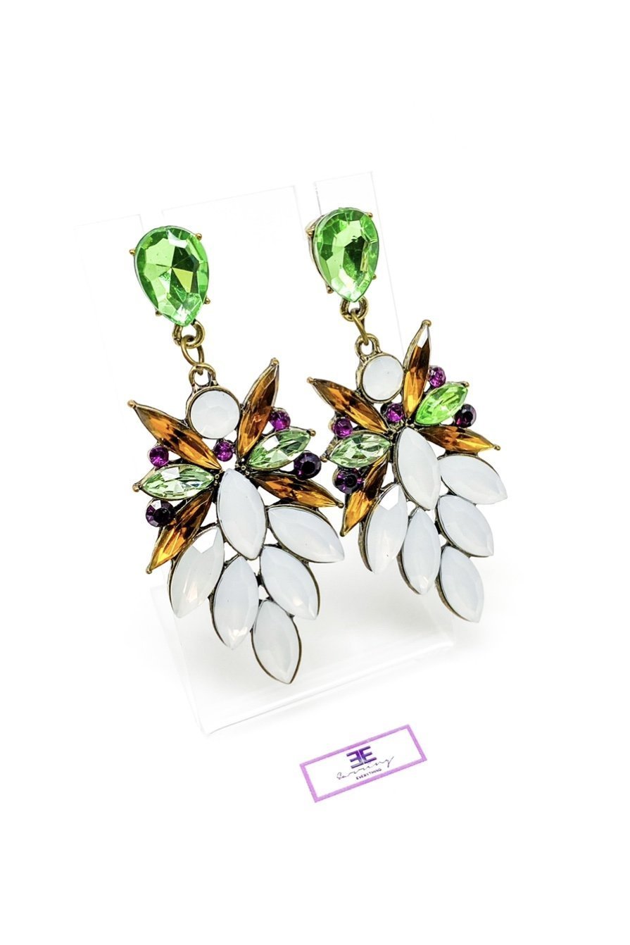 Dangle - Royale Earrings featuring crystallized stone drops in a geometric design, available in silver, green, tan, and purple.