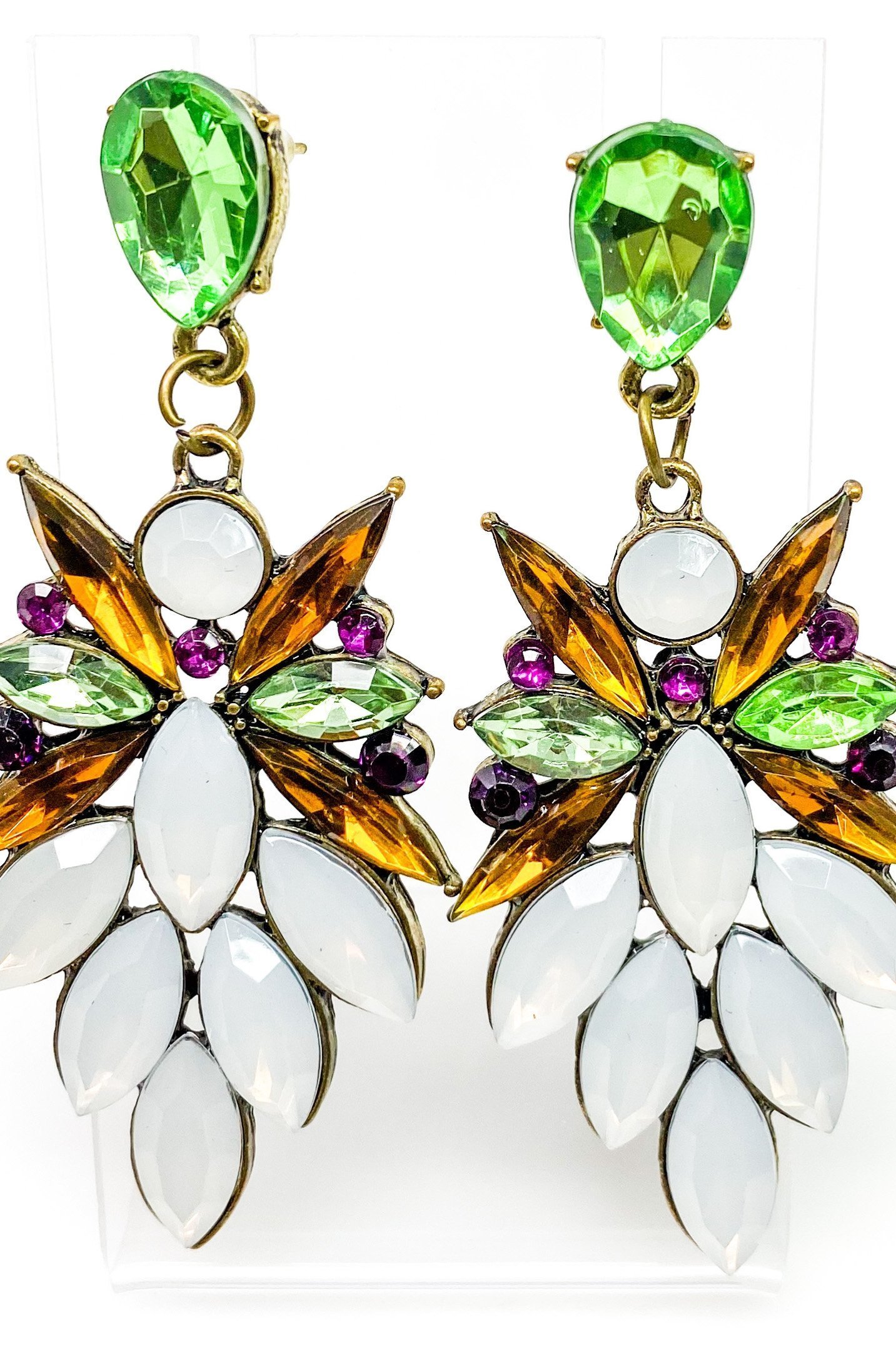 Dangle - Royale Earrings featuring crystallized stone drops in a geometric design, available in silver, green, tan, and purple.