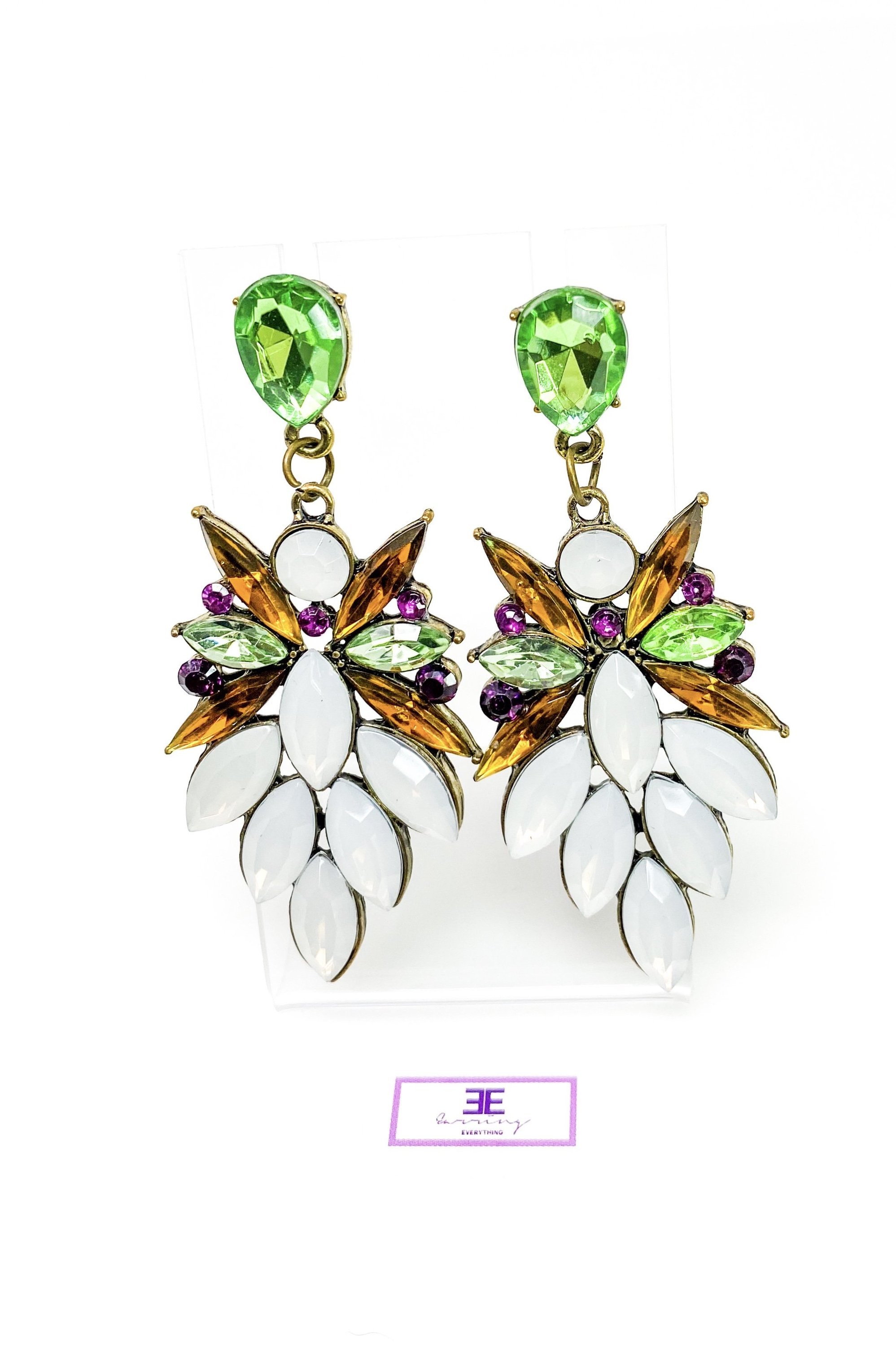 Dangle - Royale Earrings featuring crystallized stone drops in a geometric design, available in silver, green, tan, and purple.