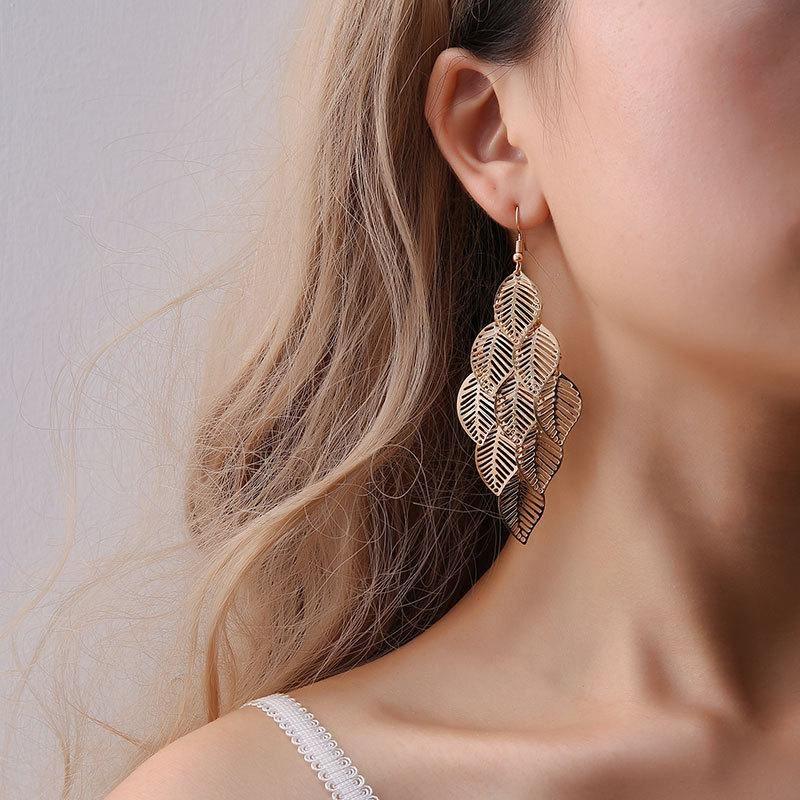 Elegant dangling leaf earrings made from high-quality zinc alloy, featuring a stylish design and 3.5-inch length.