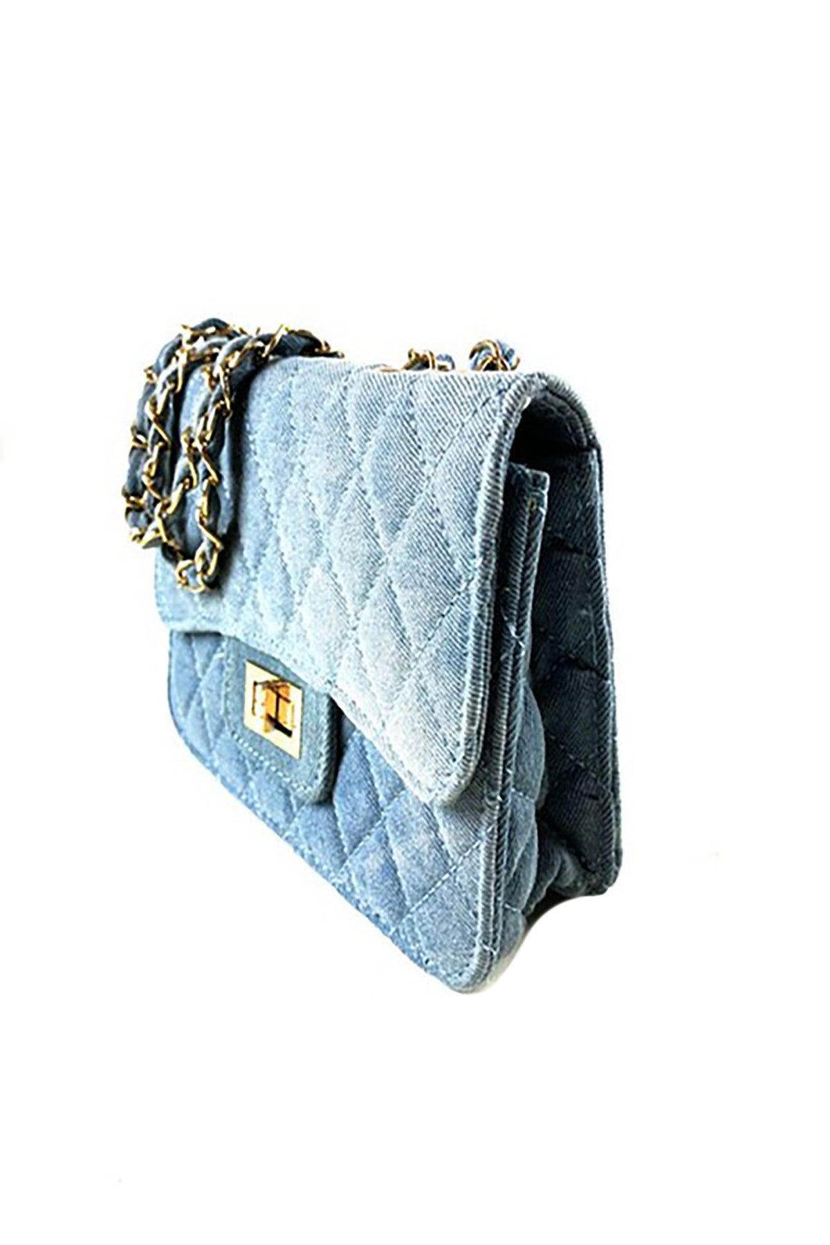 Stylish denim handbag with a flap and turn-lock closure, made from durable patent denim fabric.