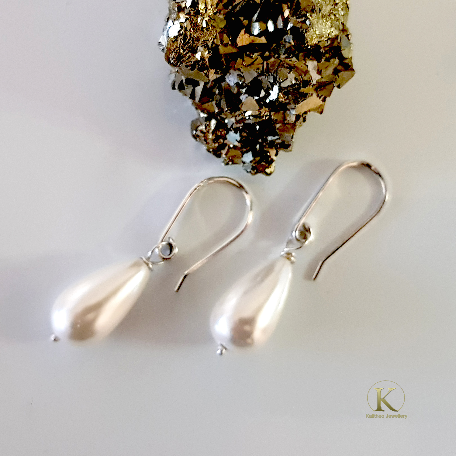 Dew Drop Teardrop Shell Pearl Earrings featuring Solid Silver 925 ear wires, showcasing elegant teardrop shell pearls in a handmade design.