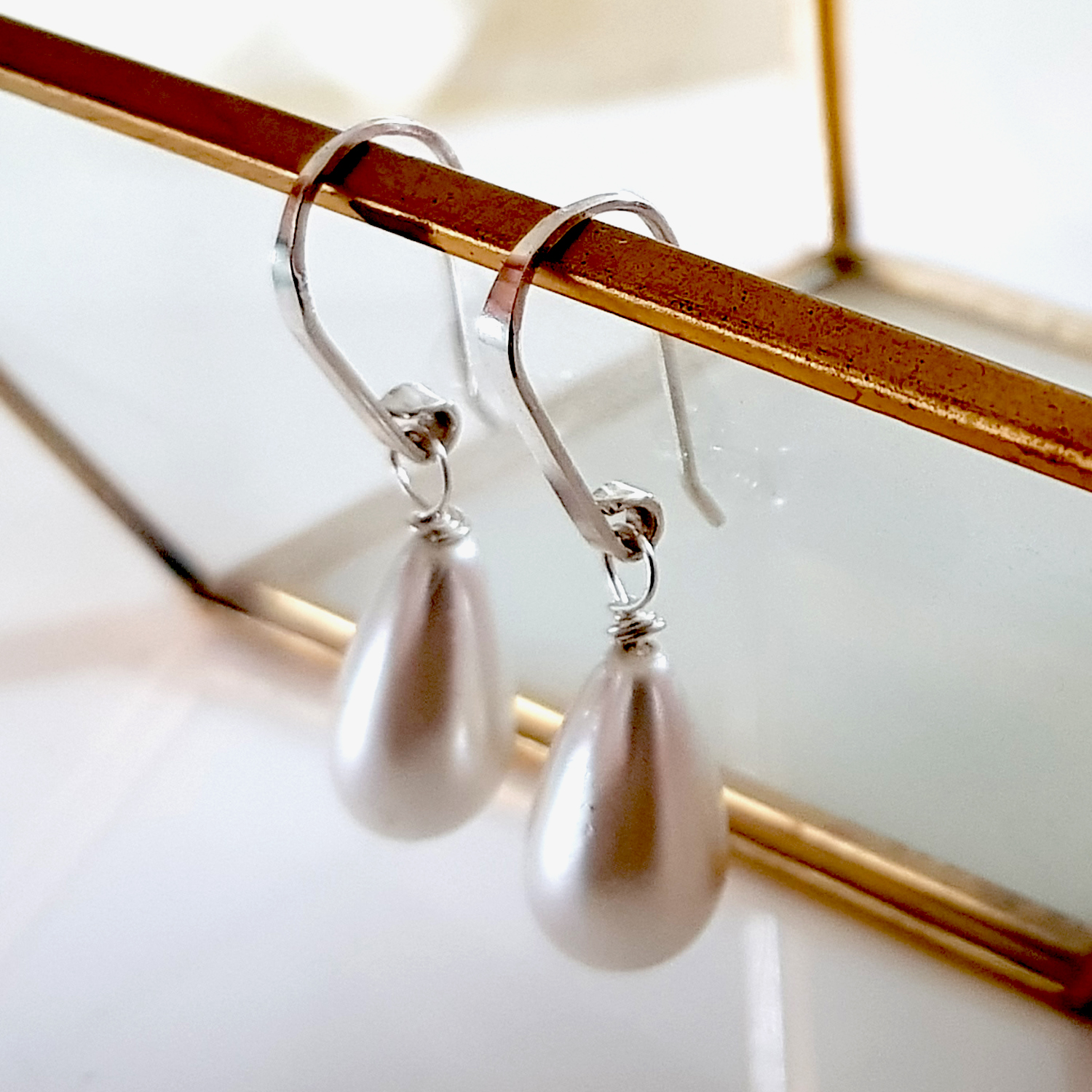 Dew Drop Teardrop Shell Pearl Earrings featuring Solid Silver 925 ear wires, showcasing elegant teardrop shell pearls in a handmade design.