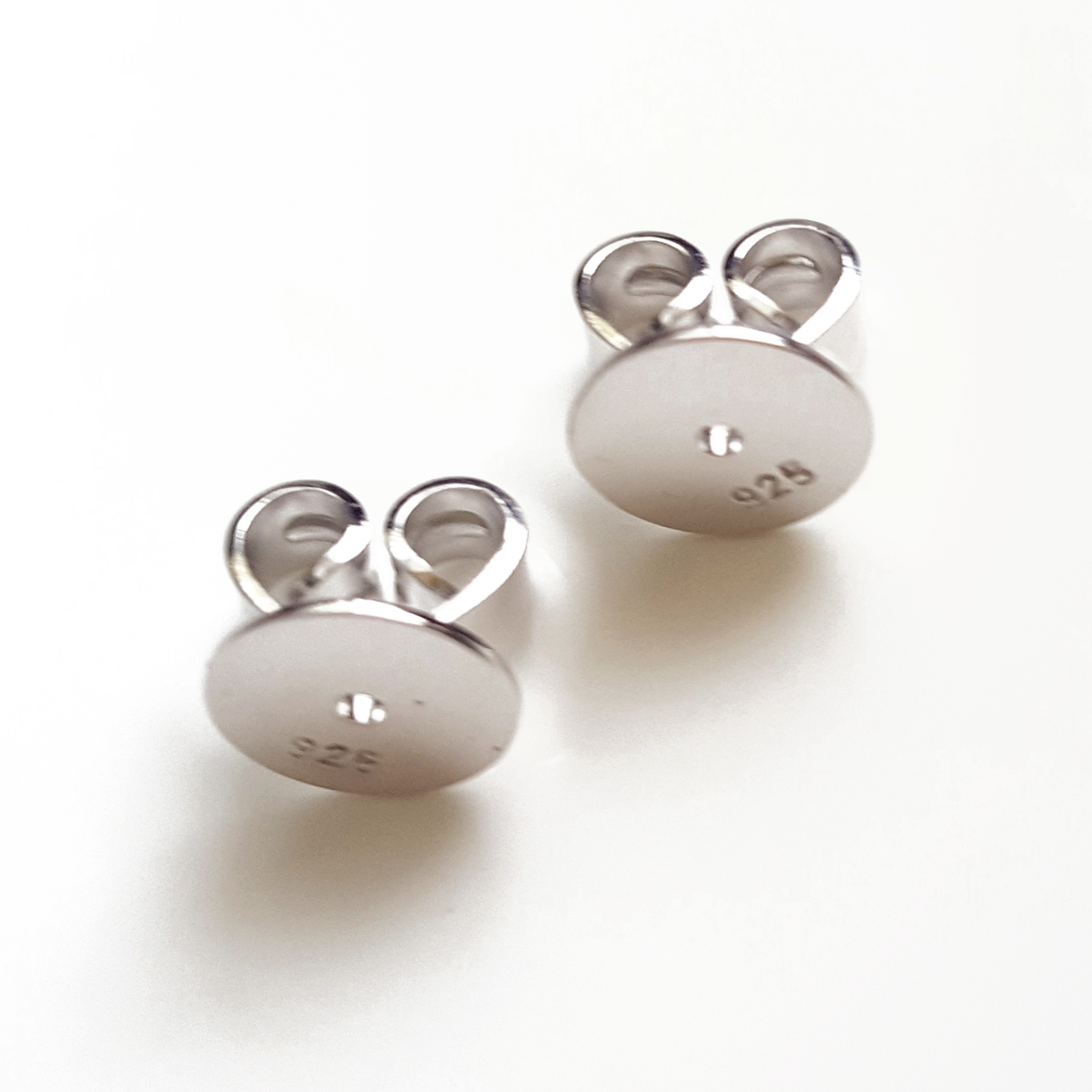 A pair of 10 mm Disc Butterfly Backs made from Sterling Silver 925, designed for secure earring support.