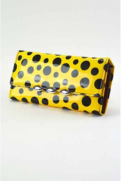 Stylish Dotted Wallet with snap closure and detachable shoulder strap, featuring inner zipper pocket and credit card slots.