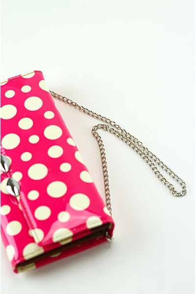 Stylish Dotted Wallet with snap closure and detachable shoulder strap, featuring inner zipper pocket and credit card slots.