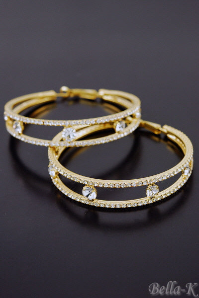 Elegant double crystal hoop earrings with a lever back closure, showcasing a chic design and double plated finish.