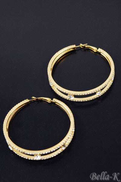 Elegant double crystal hoop earrings with a lever back closure, showcasing a chic design and double plated finish.