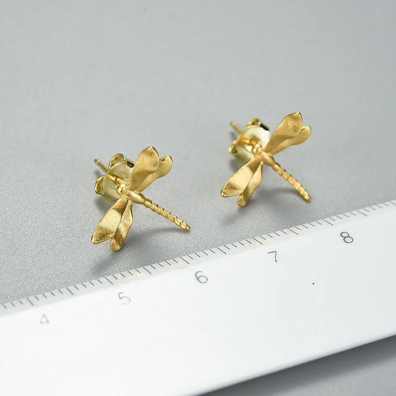 A pair of elegant Dragonfly Stud earrings made from 925 sterling silver with 18K gold plating, showcasing intricate dragonfly design.