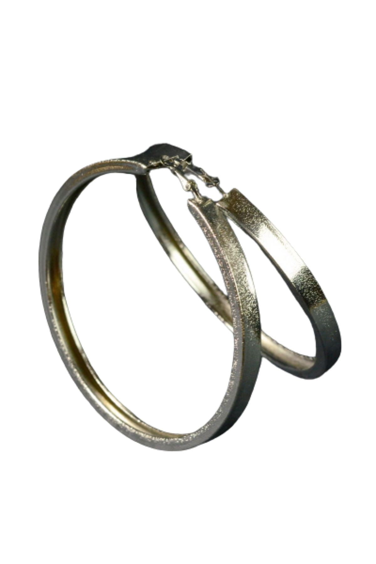 Large textured thick hoop earrings with a lever back closure, showcasing a stylish design suitable for various occasions.