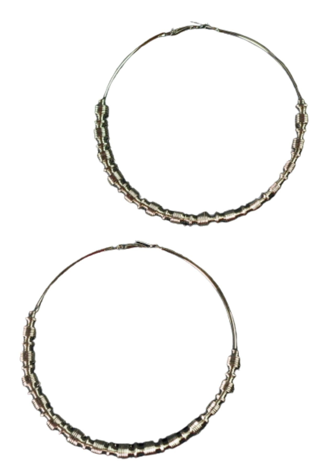 A pair of medium wavy textured hoop earrings with a double plated finish, featuring a lever back closure, elegantly displayed against a neutral background.