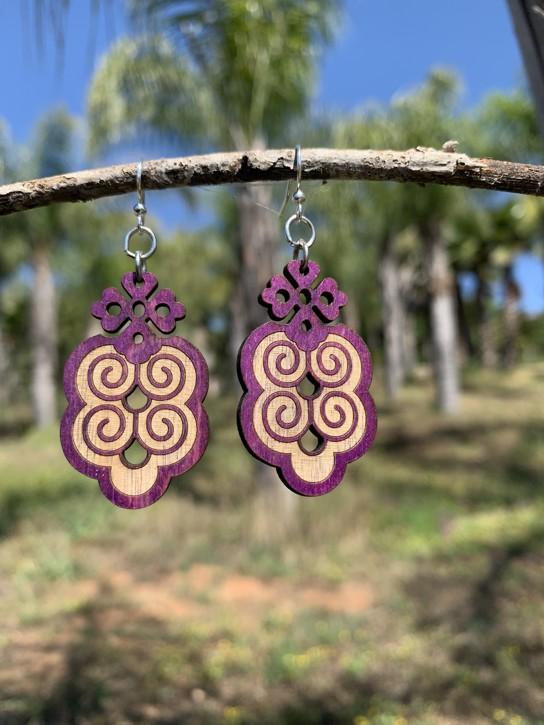 Eclecticism Earrings #T004 featuring intricate scroll-work design in purple, made from sustainable wood with hypoallergenic stainless steel ear wires.