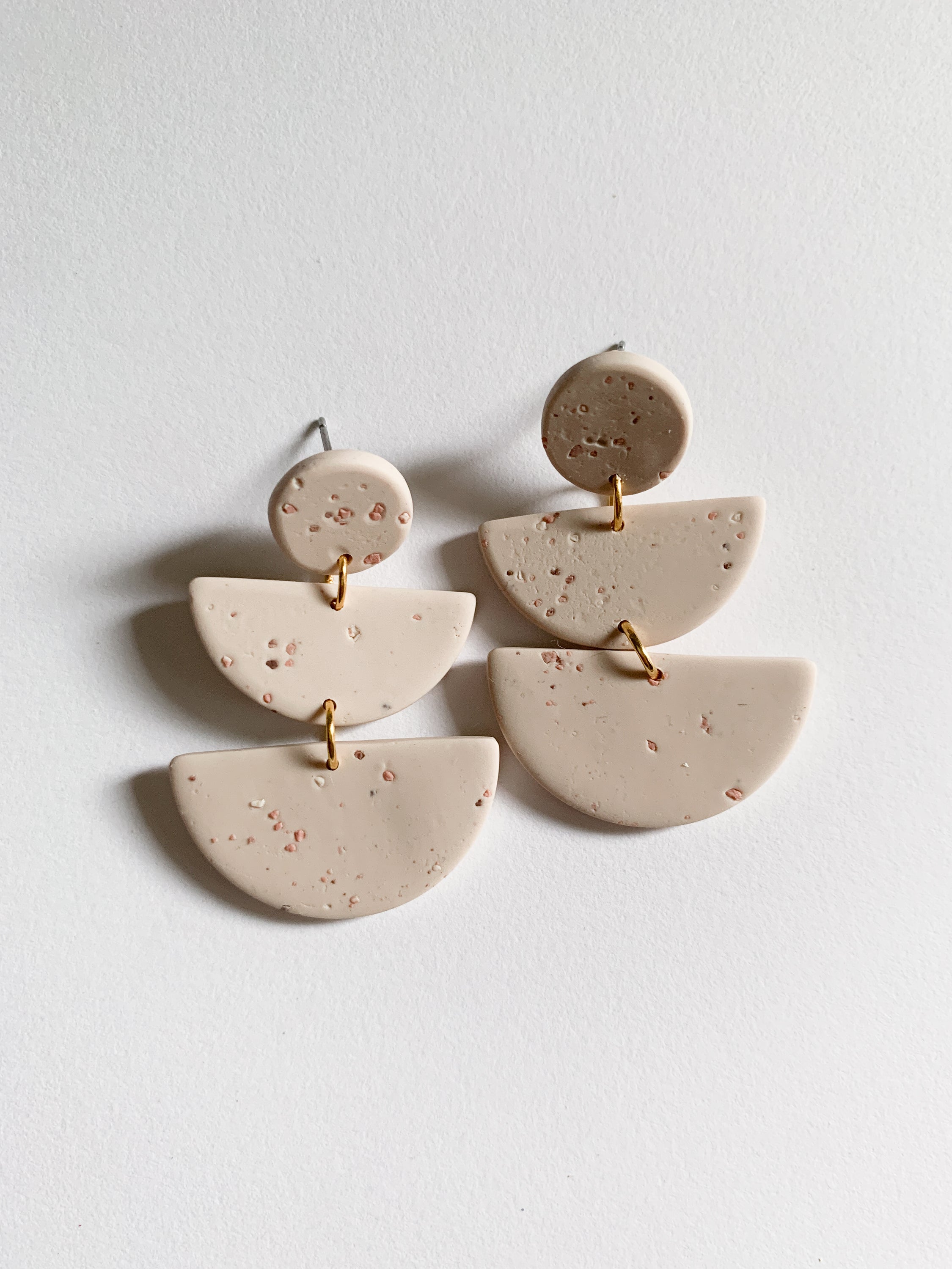 Elegant Emily Oat Milk earrings featuring hexagon triple teardrop design in soft creamy color, perfect for any outfit.