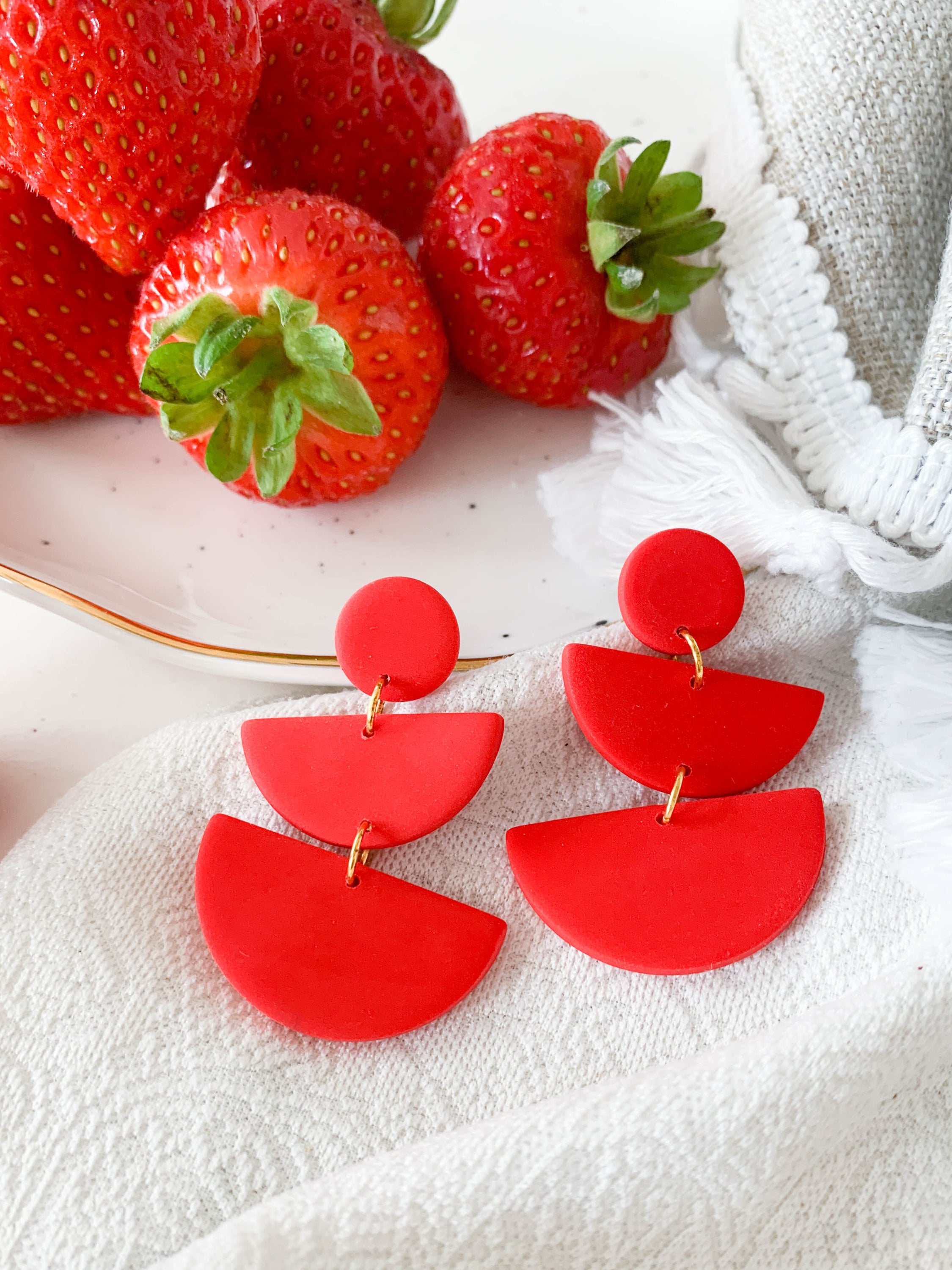 Emily Strawberry earrings featuring surgical steel posts, designed for sensitive ears, showcasing a vibrant strawberry design.