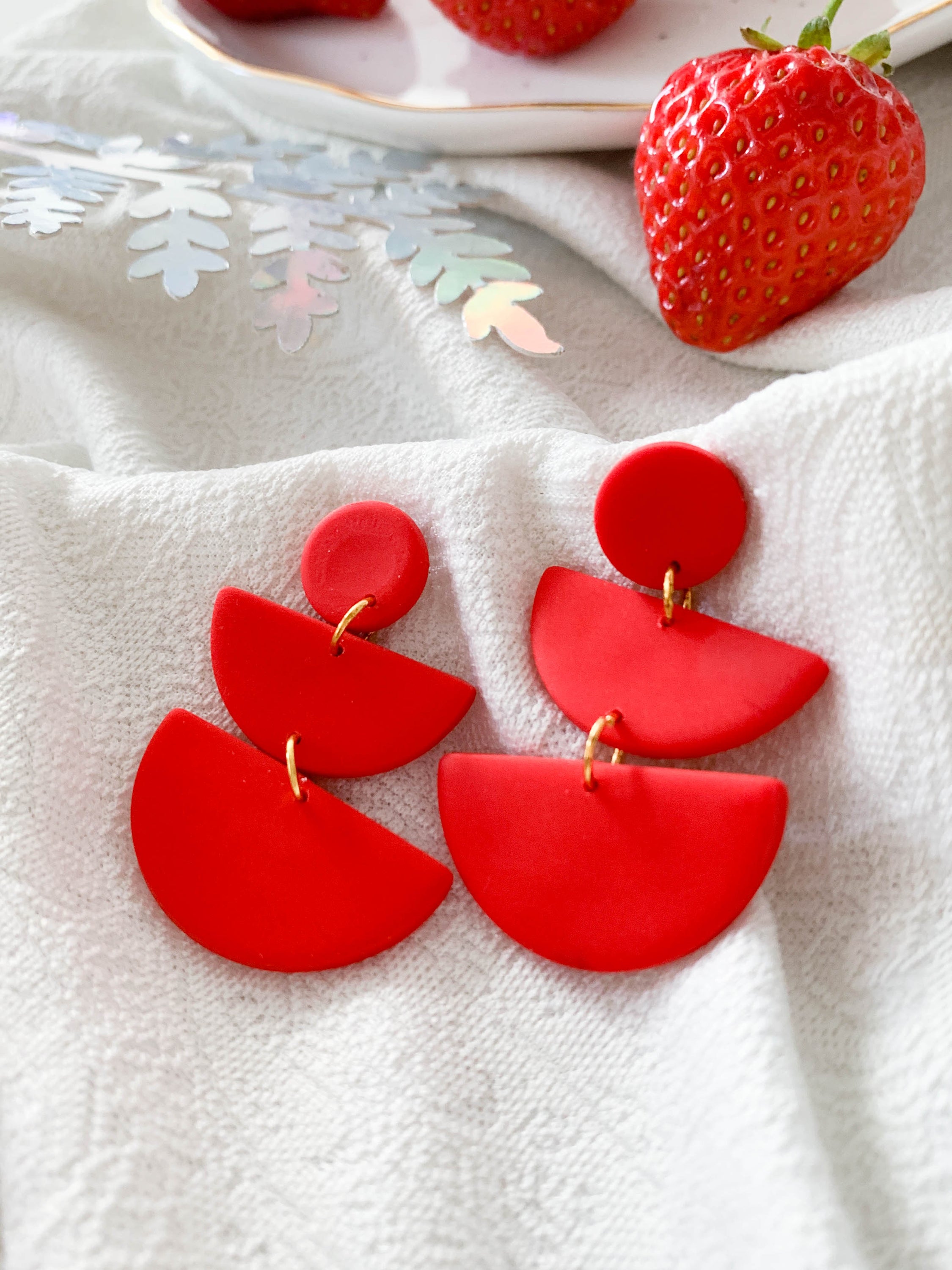 Emily Strawberry earrings featuring surgical steel posts, designed for sensitive ears, showcasing a vibrant strawberry design.