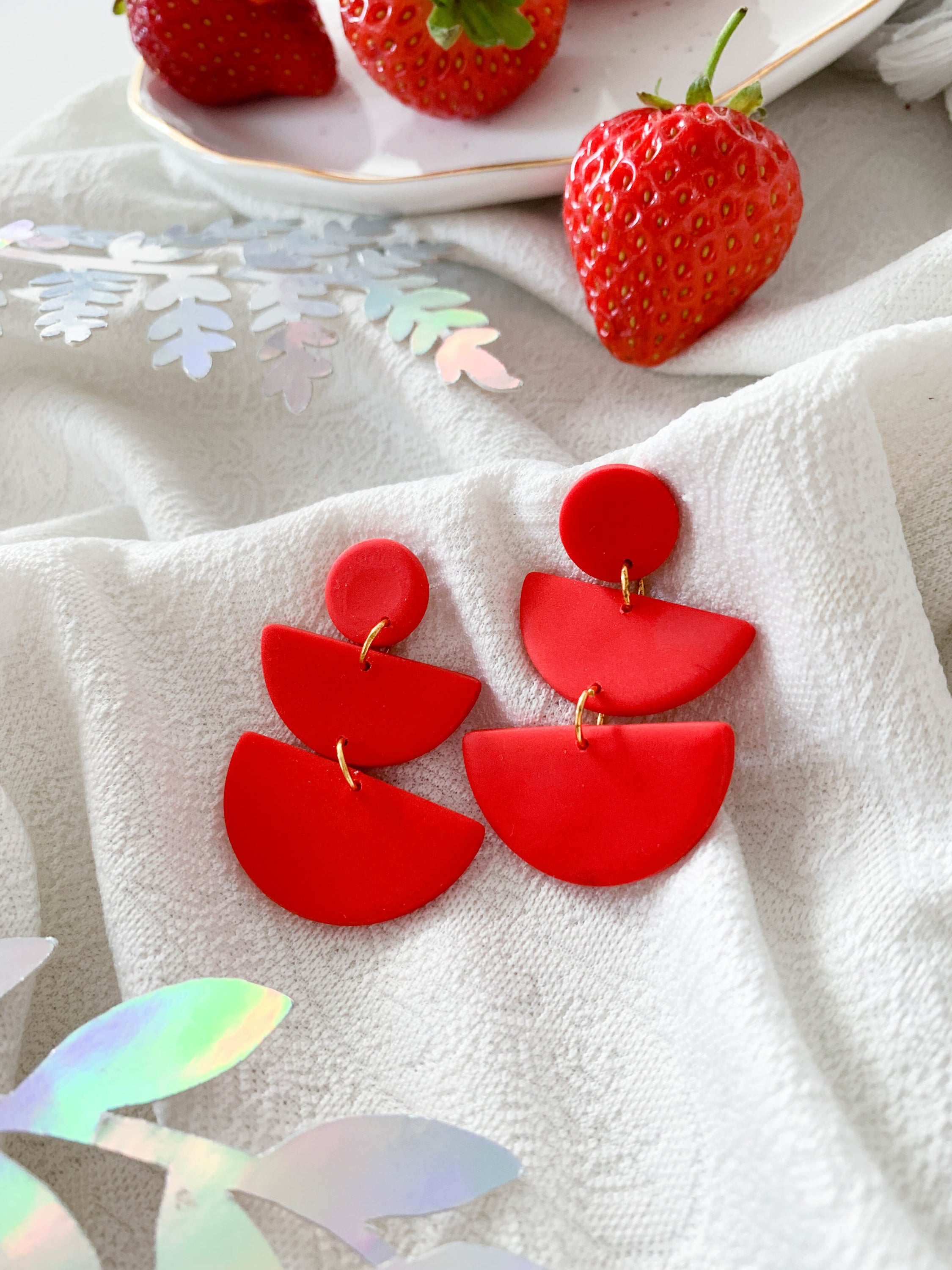 Emily Strawberry earrings featuring surgical steel posts, designed for sensitive ears, showcasing a vibrant strawberry design.