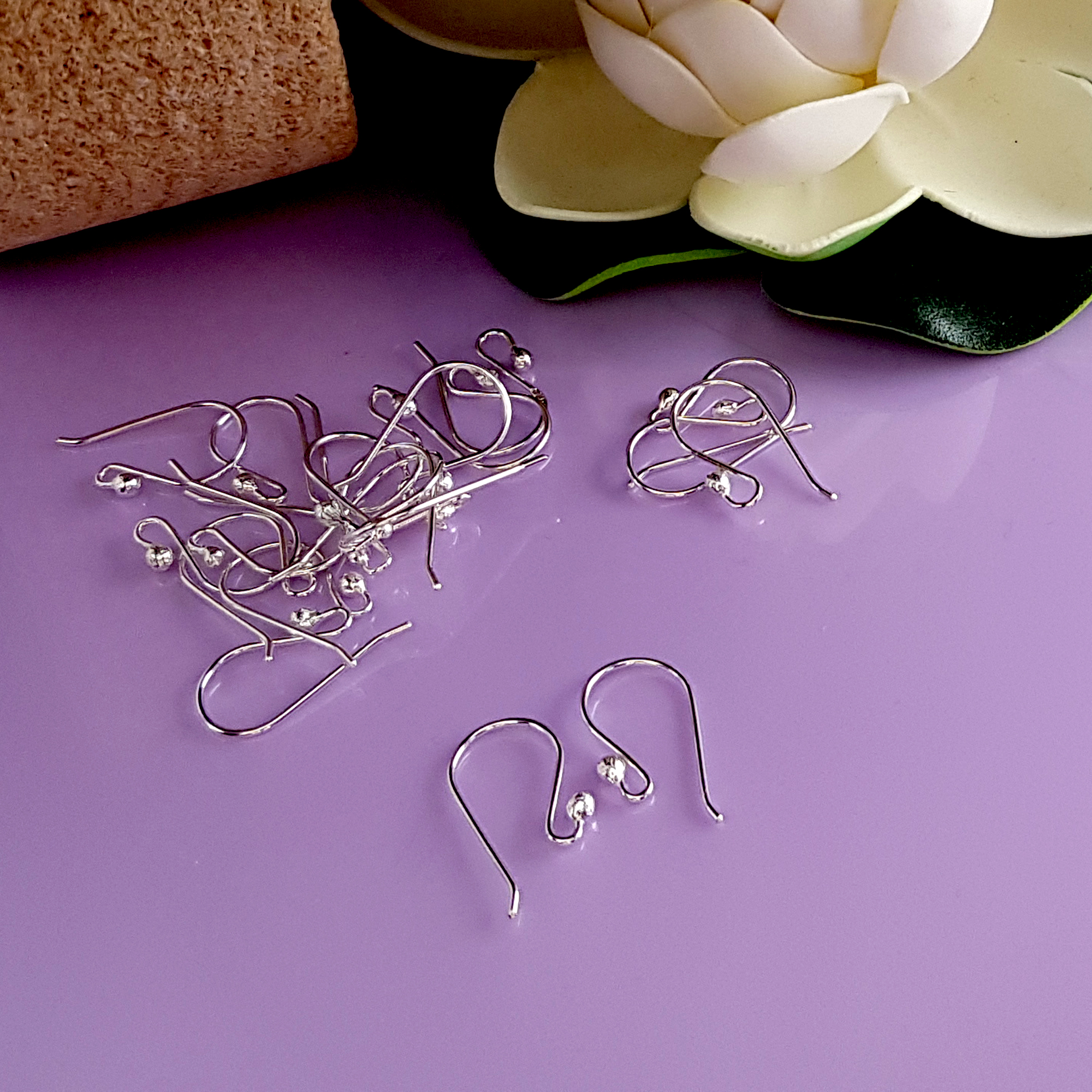 A close-up view of 10 pairs of Euro Style Hooks made from sterling silver, showcasing their elegant design and polished finish.