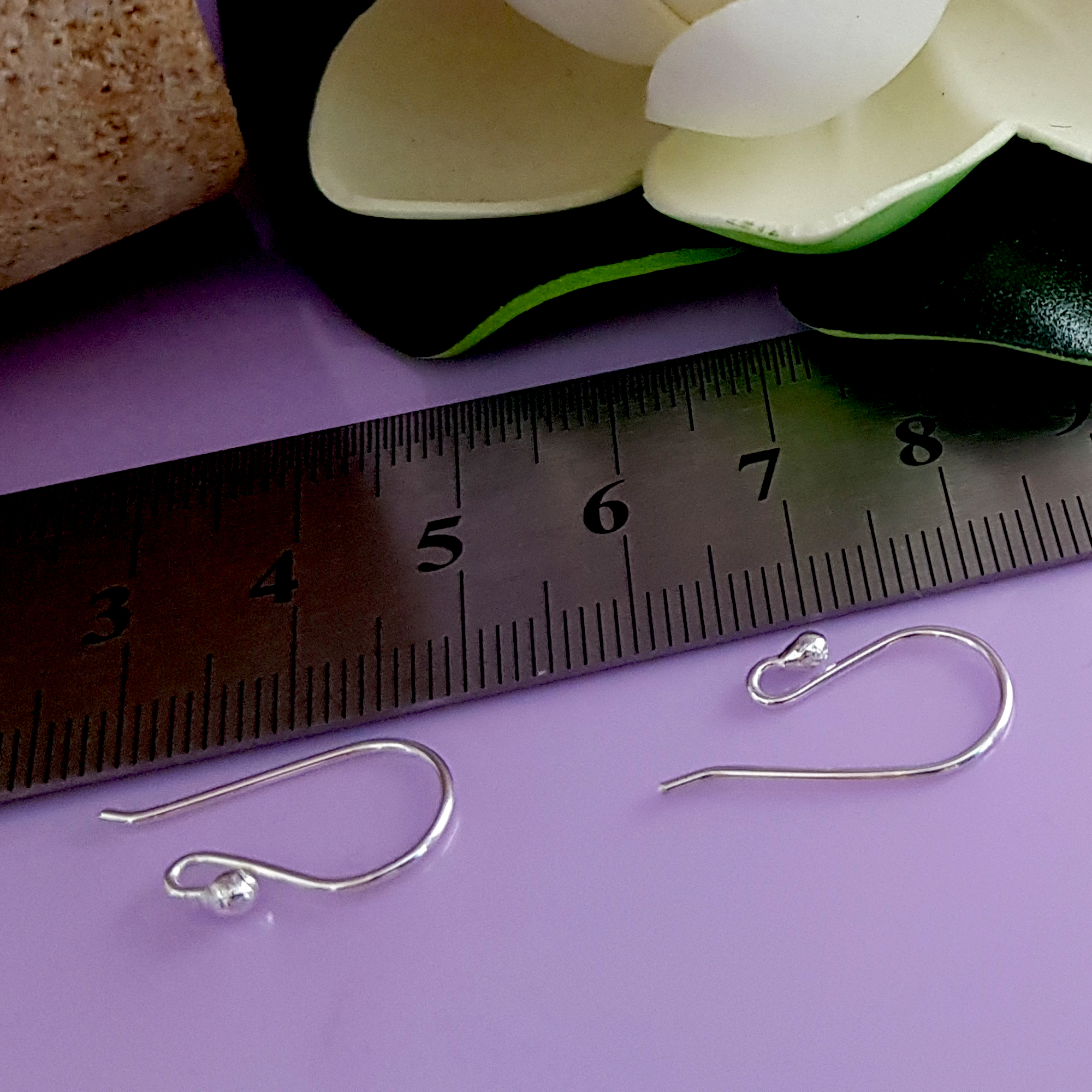 A close-up view of 10 pairs of Euro Style Hooks made from sterling silver, showcasing their elegant design and polished finish.