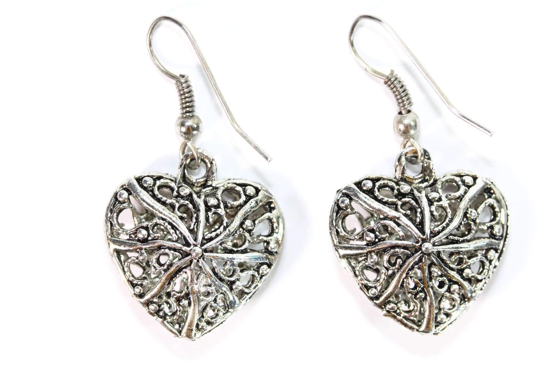 A pair of elegant filigree heart earrings showcasing intricate designs and a 3D effect, made from durable base metal.