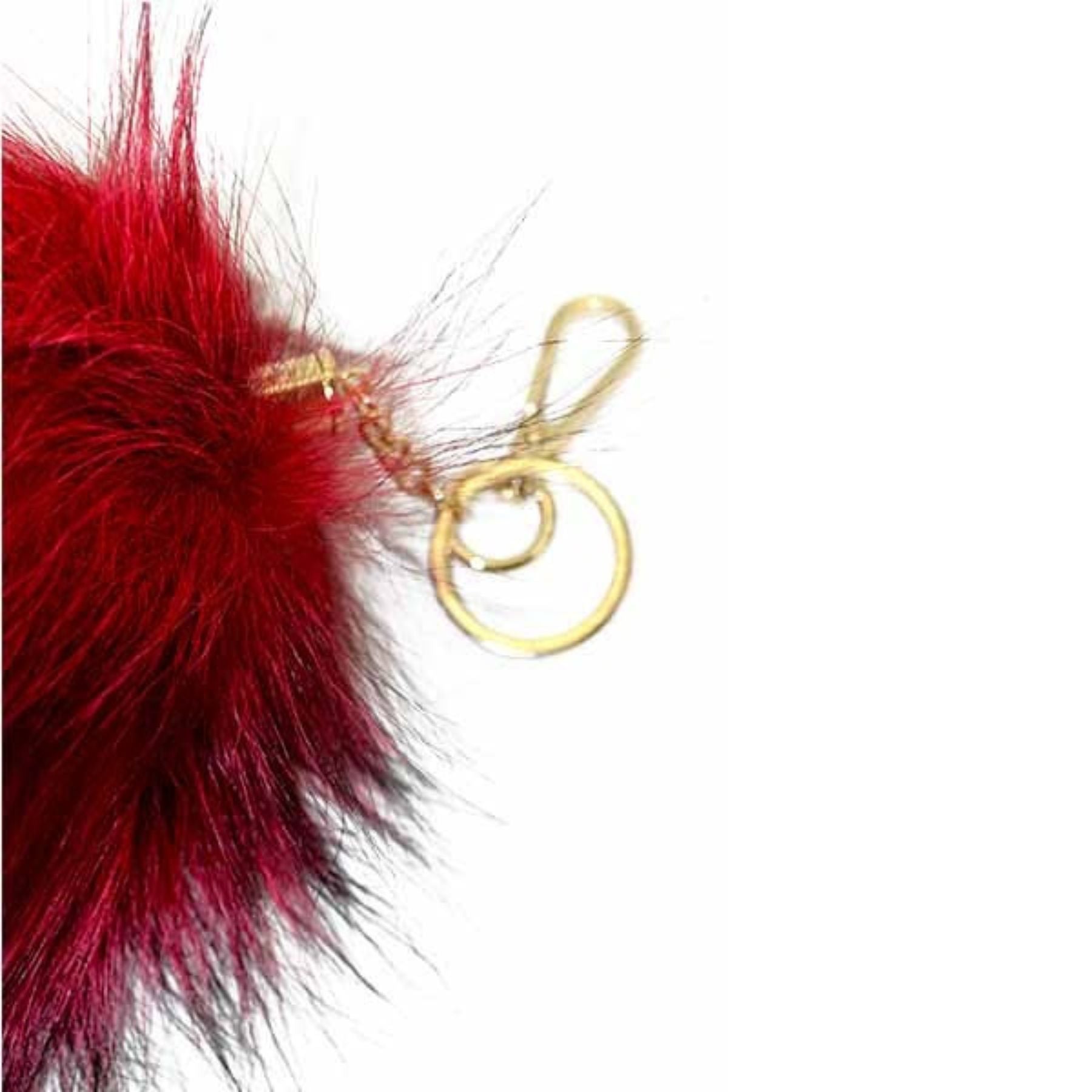 A stylish Fox Tail Fur Key Chain featuring a luxurious fur design and a durable lobster claw clasp, perfect for adding elegance to your accessories.