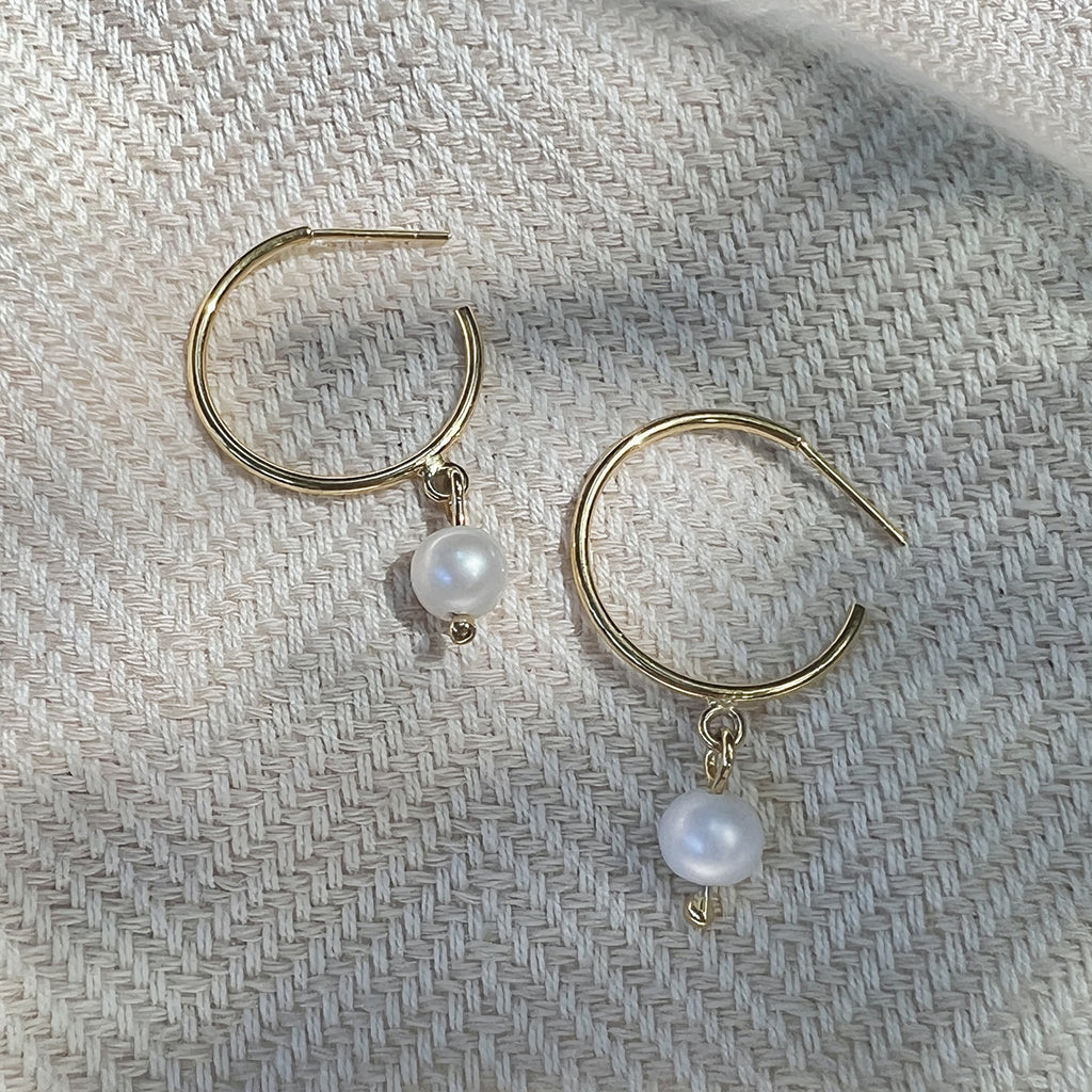 Handcrafted Freshwater Pearl Hoop Earrings made from recycled bombshells with gold plating and freshwater pearls.