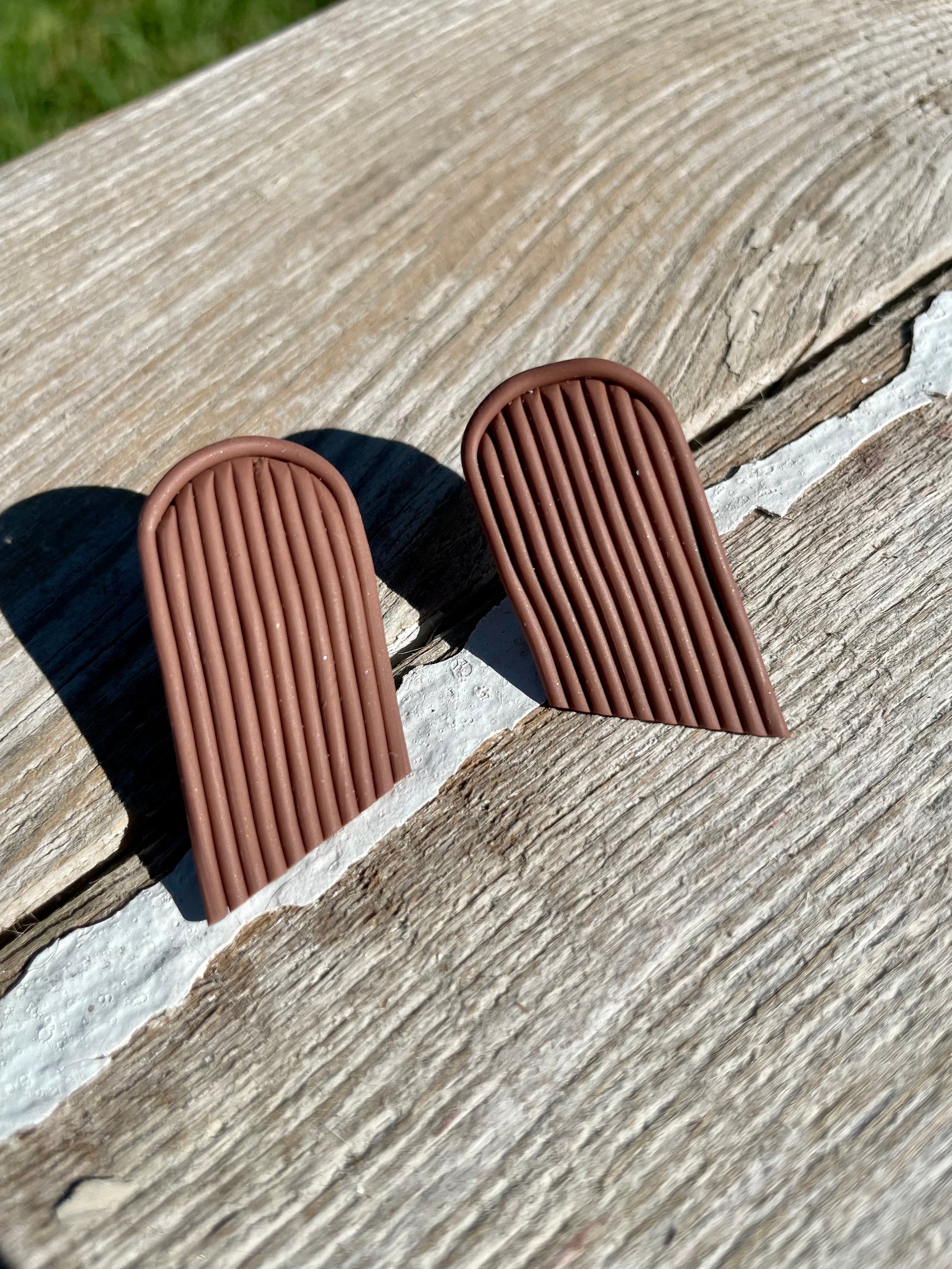 A pair of handmade Fringe Studs featuring unique patterns and colors, crafted in Utah with stainless steel hooks.