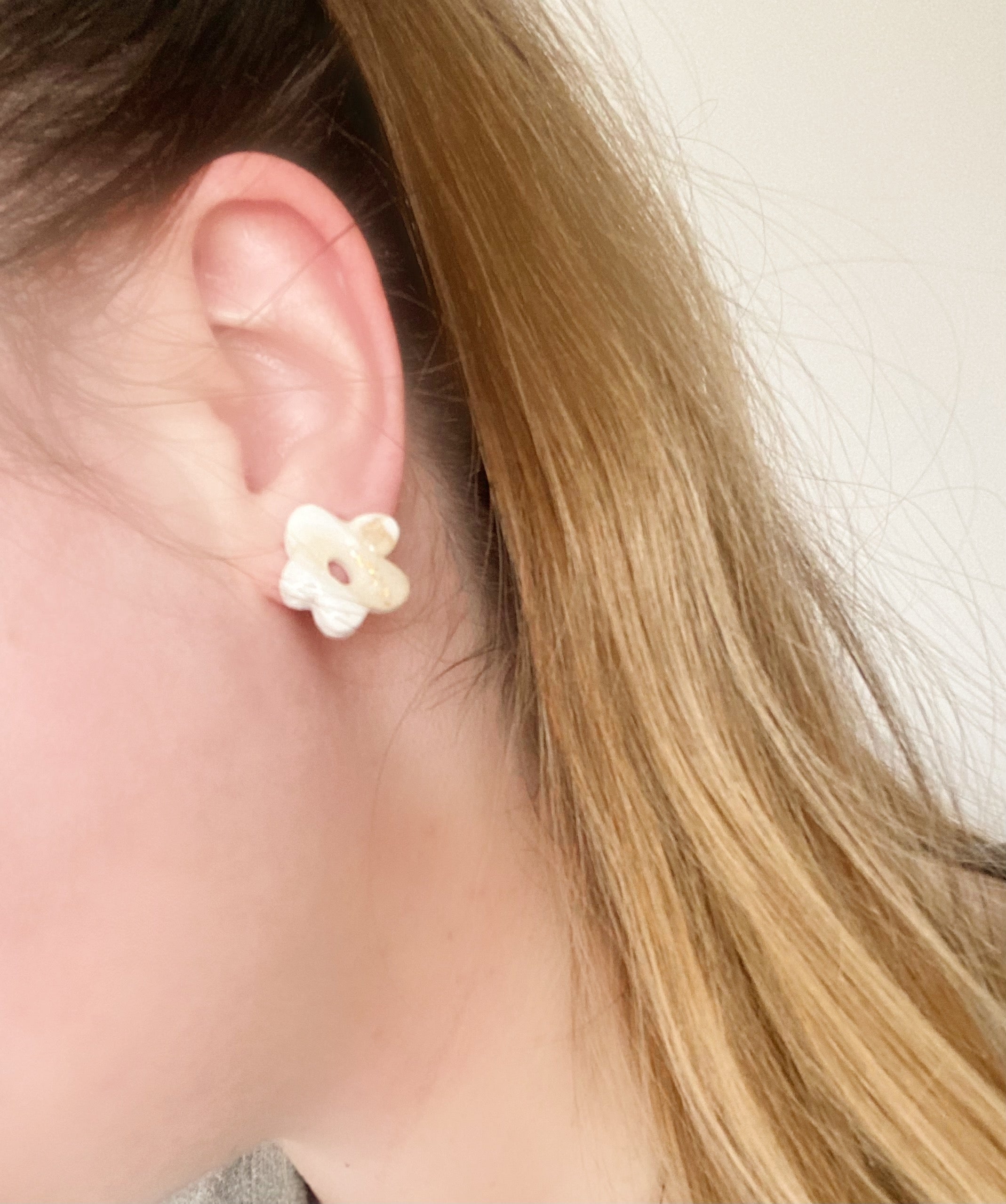 A pair of colorful, handcrafted Funky Flower Studs earrings featuring unique floral designs, made with hypoallergenic materials.