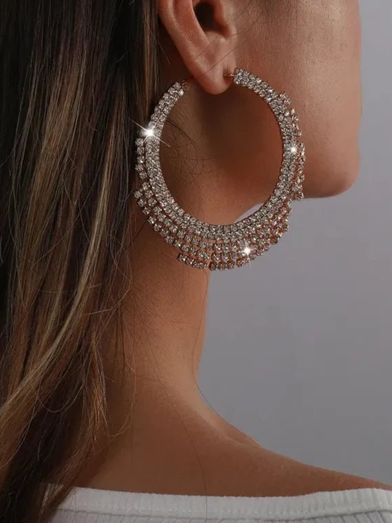 A pair of stunning Glammed Out Diamond Hoops featuring geometric rhinestone design in gold and silver finishes.