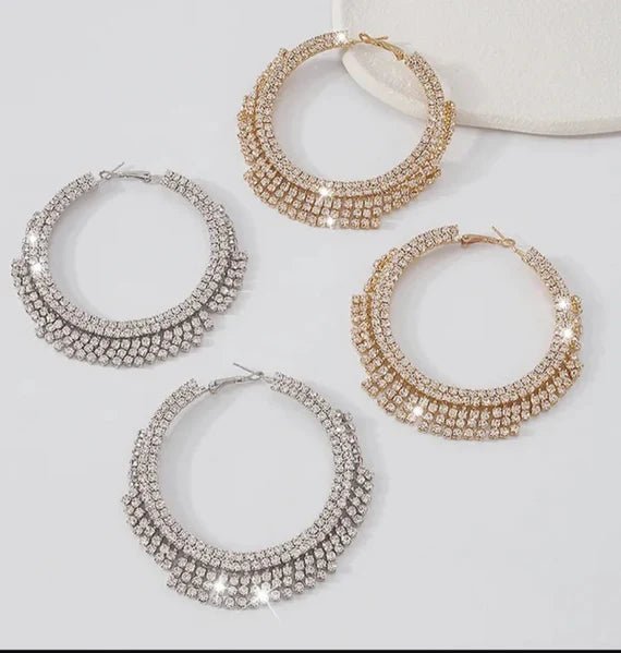 A pair of stunning Glammed Out Diamond Hoops featuring geometric rhinestone design in gold and silver finishes.