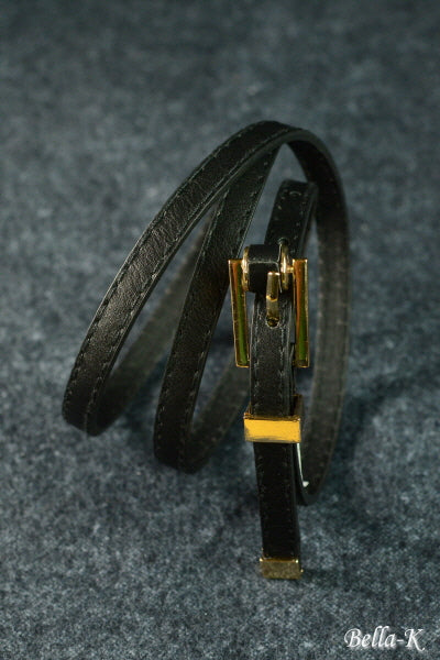 Gold Buckle Belt made of simulated leather with gold-tone hardware, featuring five adjustable holes for a perfect fit.