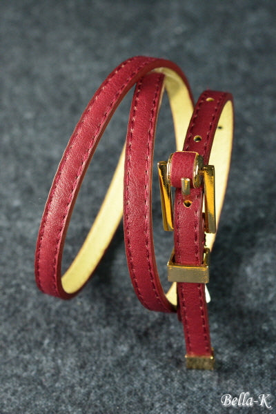 Gold Buckle Belt made of simulated leather with gold-tone hardware, featuring five adjustable holes for a perfect fit.