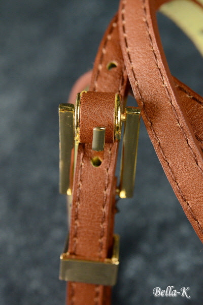 Gold Buckle Belt made of simulated leather with gold-tone hardware, featuring five adjustable holes for a perfect fit.