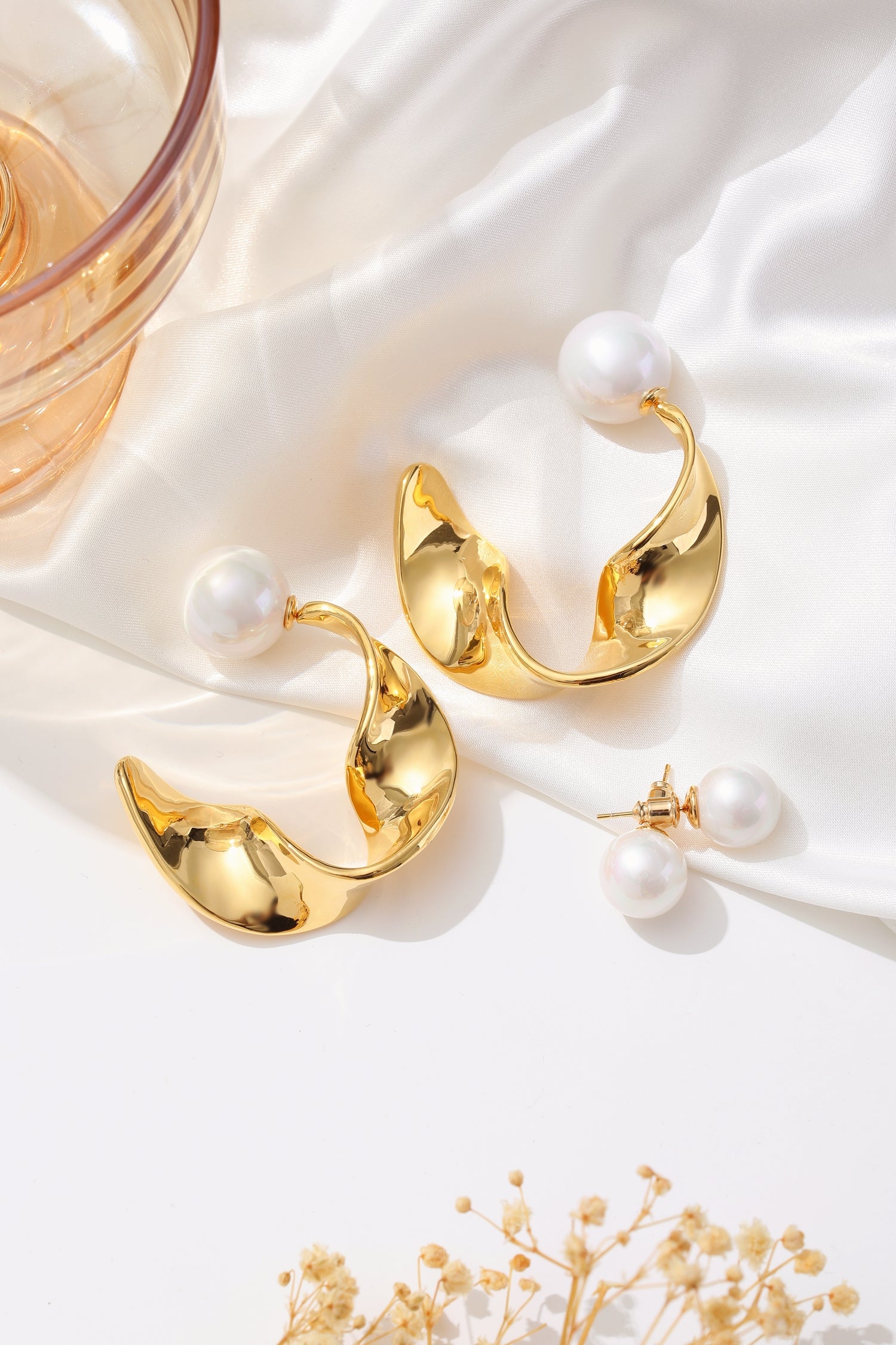 Gold Chunky Wave Hoop Earrings featuring a unique waved design and pearl accents, perfect for any occasion.