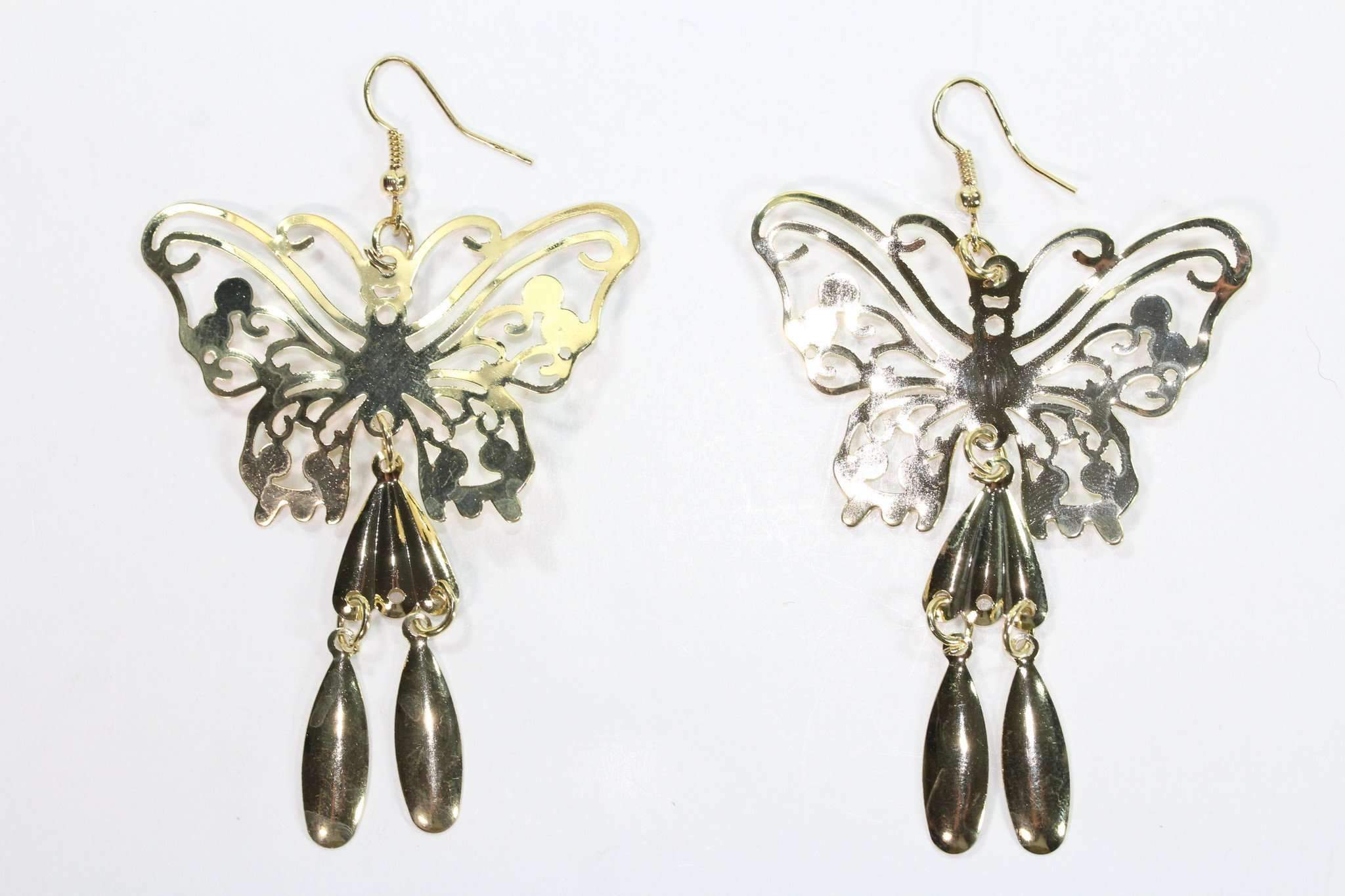 Elegant golden butterfly earrings with sparkling finish, showcasing intricate design and beautiful craftsmanship.